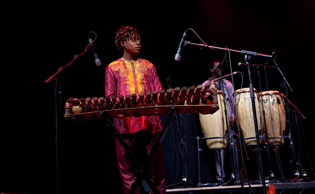 Sona Jobarteh&rsquo;s 14-year-old son, Sidiki Jobarteh-Codjoe, playing onstage with his mother