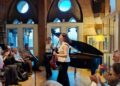 Ezo Sarıcı and Deniz Cengiz of Duo Ekeš receiving applause at St Pancras Clock Tower