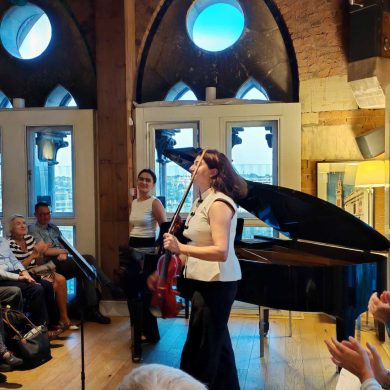 Ezo Sarıcı and Deniz Cengiz of Duo Ekeš receiving applause at St Pancras Clock Tower